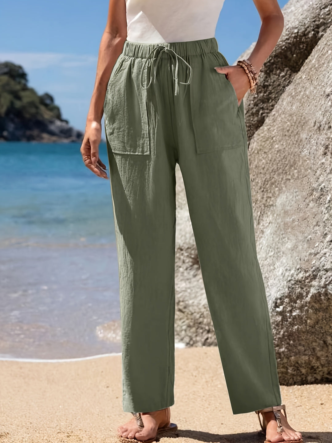 Loose beach pants for women with elastic waistband and practical pockets Lune London