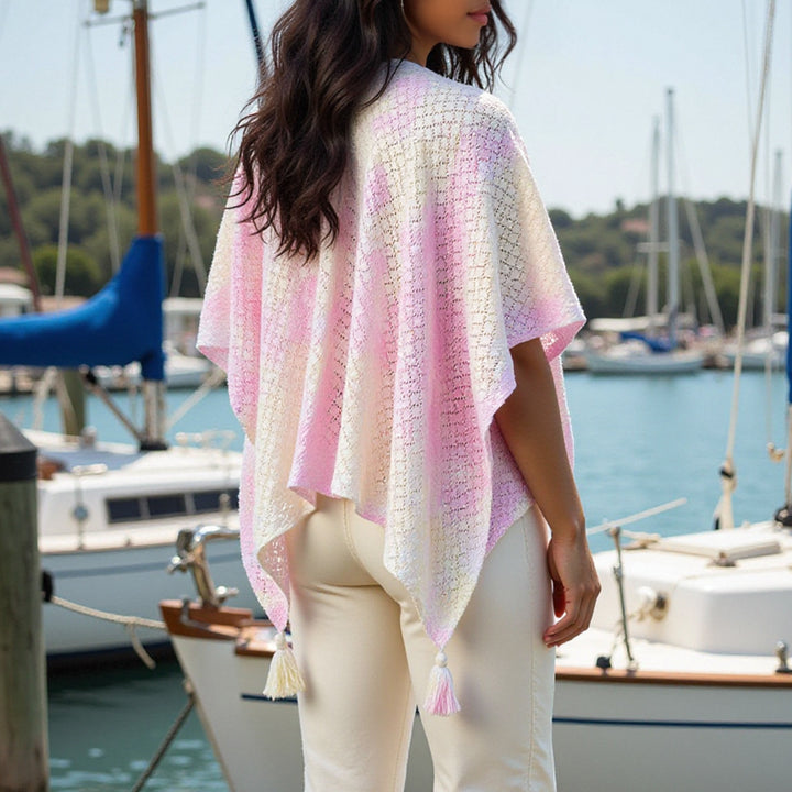 Airy knitted poncho for ladies with decorative fringes Lune London