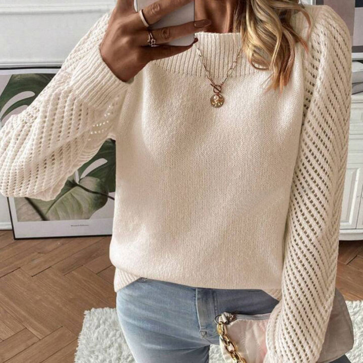 Pull en tricot pour femmes avec des manches trouées à la mode et un col rond Chic & Stil