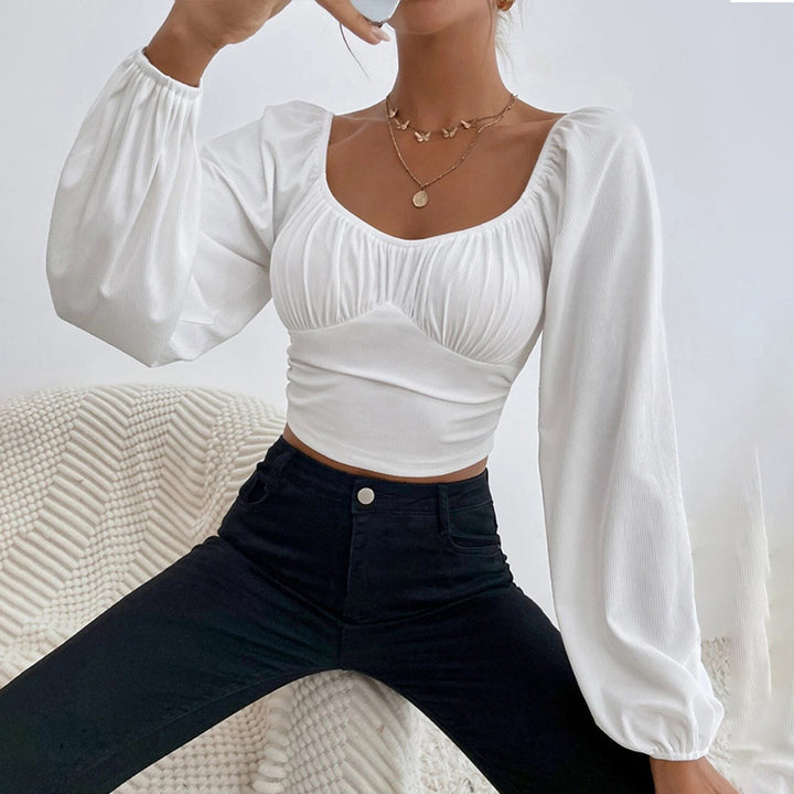 Chic & Stil Elegant puff sleeve design women's crop top with fitted silhouette