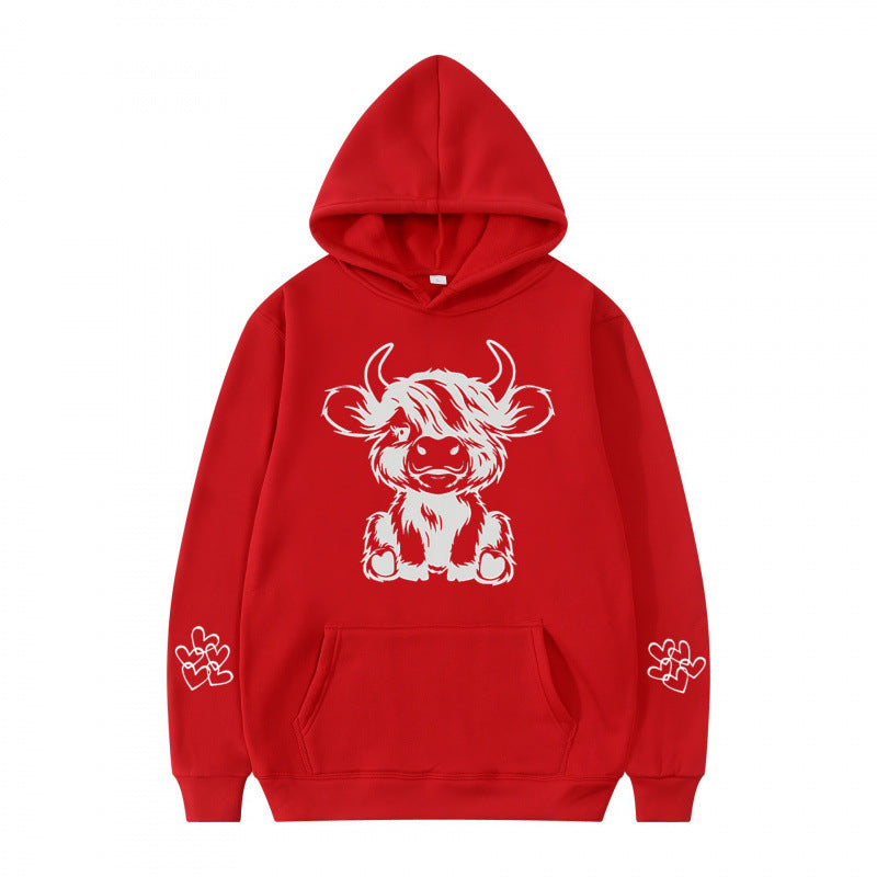 Women's hooded sweatshirt with charming cow motif and practical kangaroo pockets Lune London