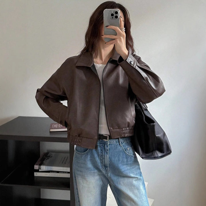 Trendy short coat for women in soft faux leather with elastic straps Lune London