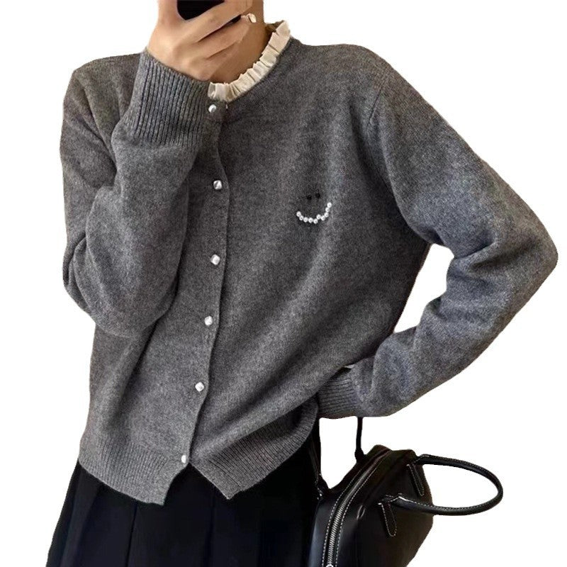 Women’s knitted jacket with decorative buttons and festive design Lune London