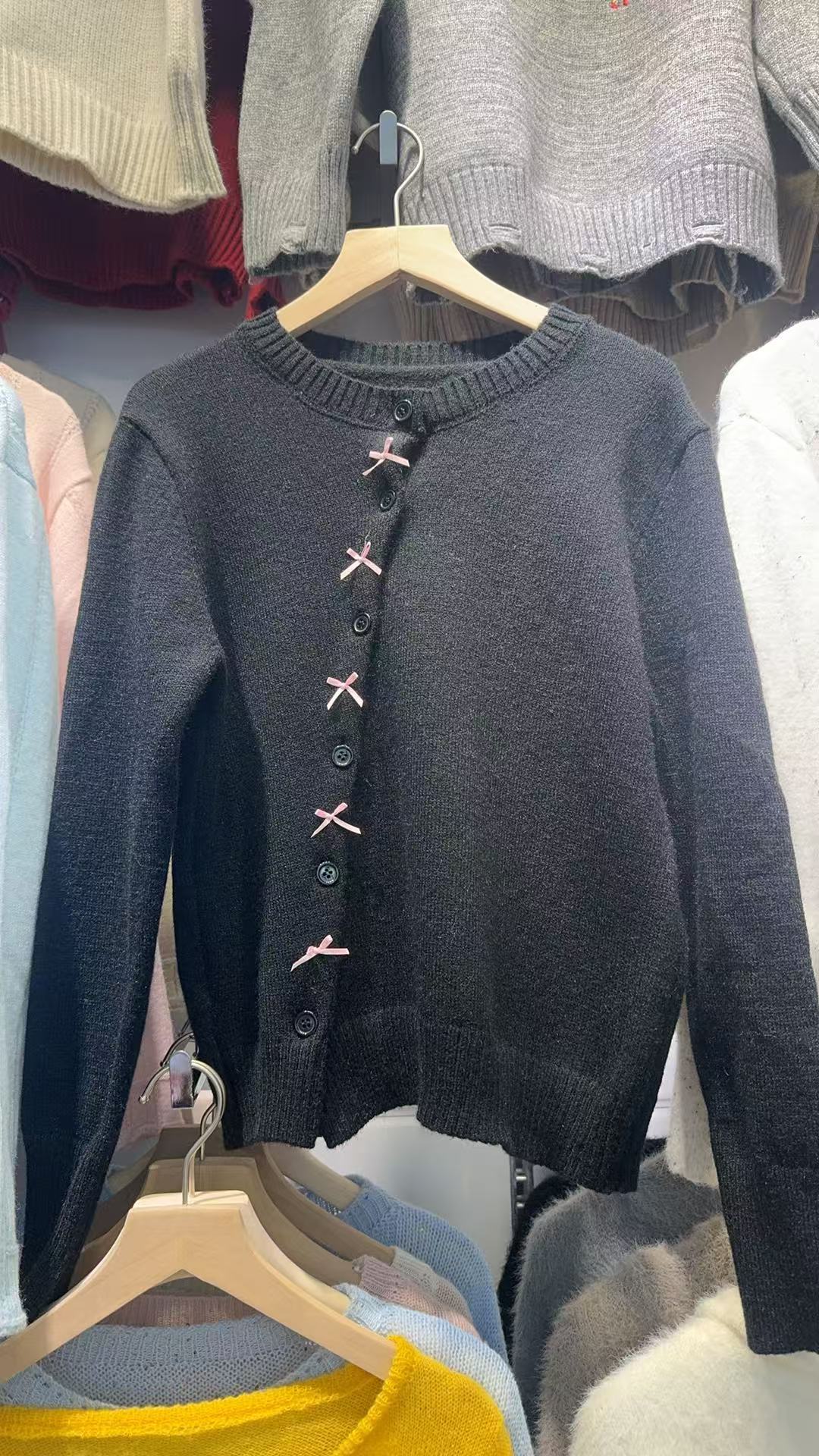 Women cozy knit cardigan with playful bow accents Lune London