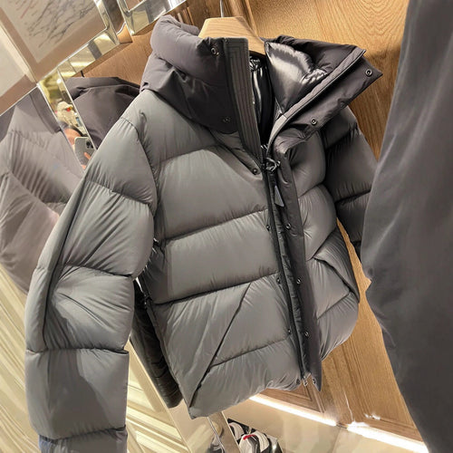Ladies down jacket with high collar and practical zippered pockets Lune London
