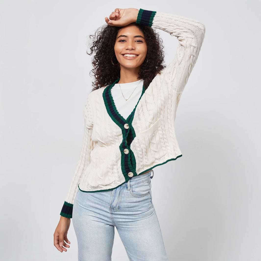 Chunky knit cardigan for women with decorative button placket and matching hem.