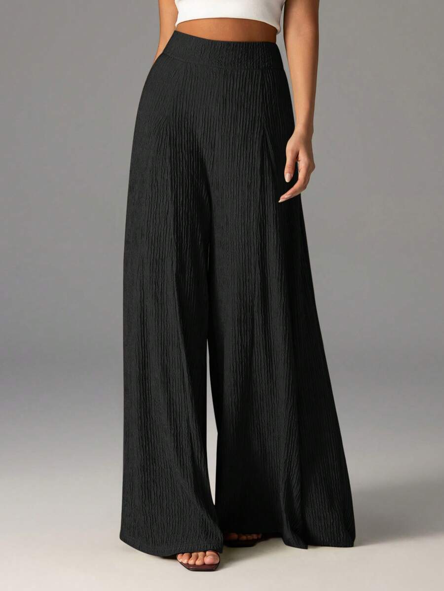 Wide pleated pants for women with high waist and elastic waistband Lune London
