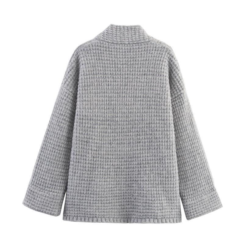 Ladies quilted knit with decorative button closure and high collar Lune London