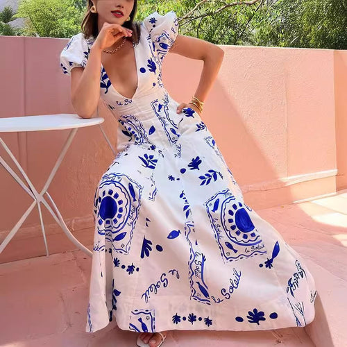 Maxi dress for women with voluminous puff sleeves and floral patterns Lune London