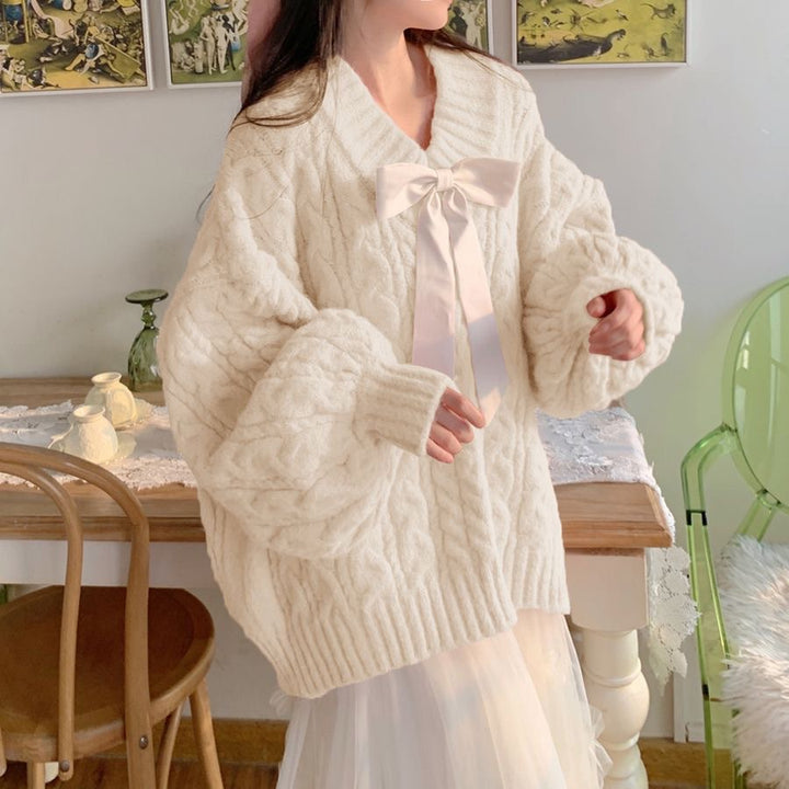 Ladies Large knitted sweater with bow detail and cable knit pattern Lune London