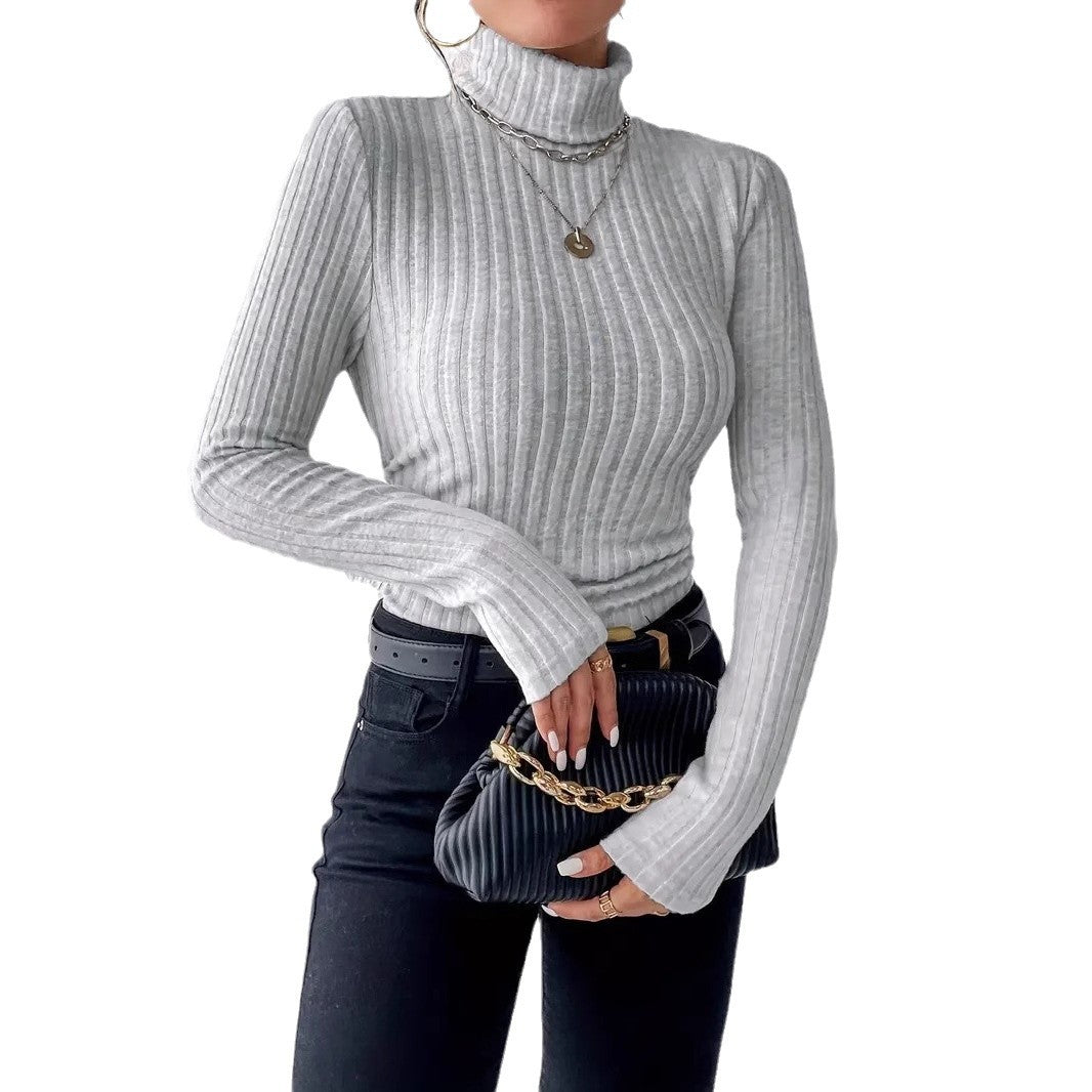 Ladies elegant ribbed knit top with high collar and longer cut Lune London
