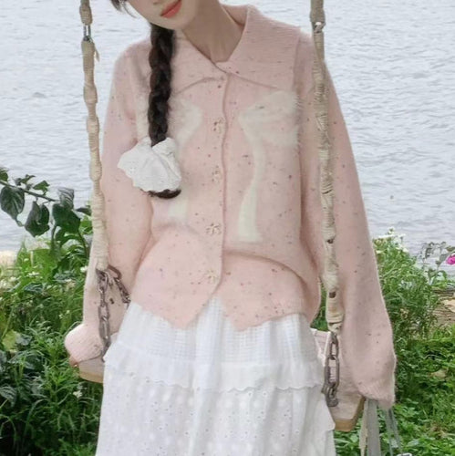 Women’s playful knitted vest with decorative button details and fluffy applications Lune London