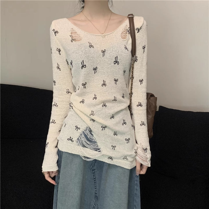 Women's long sleeve shirt with stylish rips and playful motif Lune London