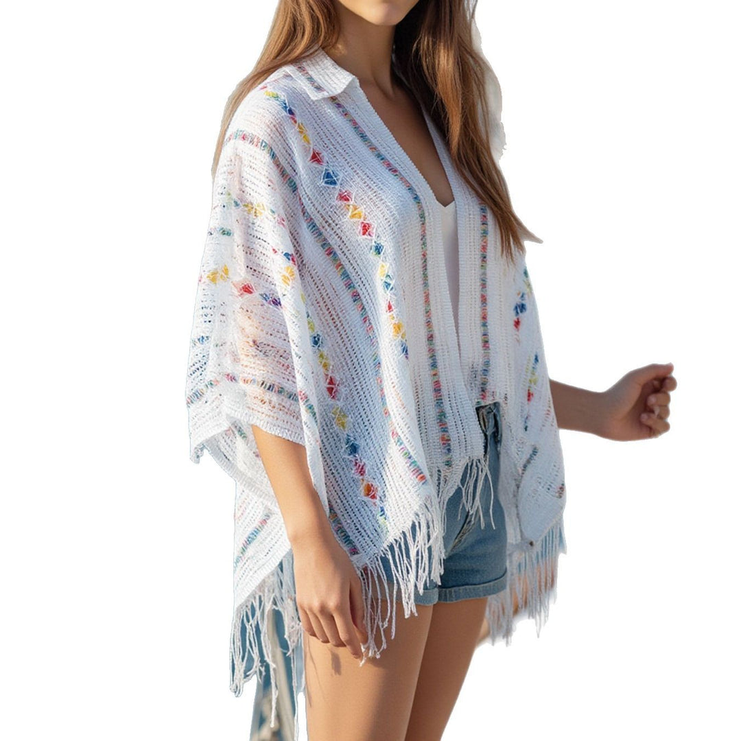 Ladies casual poncho with fringe details and a chic and stylish colorful pattern
