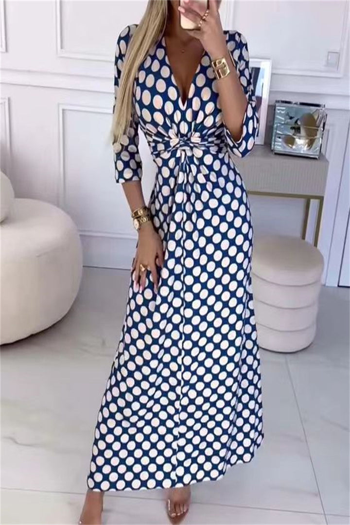Maxi dress for women with a modern polka dot pattern and an elegant crossover appearance Lune London