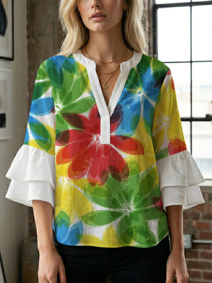 Women’s blouse with voluminous ruffled sleeves and floral pattern Lune London