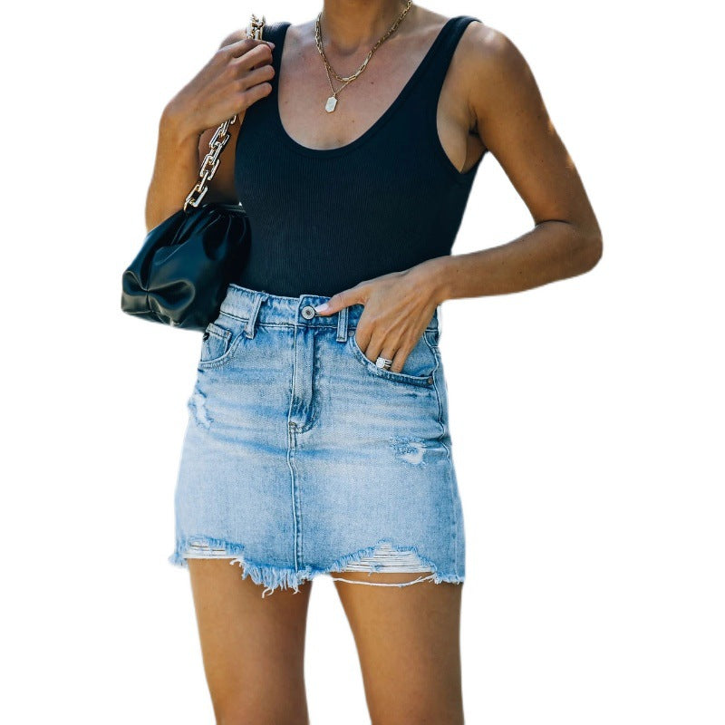 Women's denim skirt in a casual used look with fringed hems Lune London
