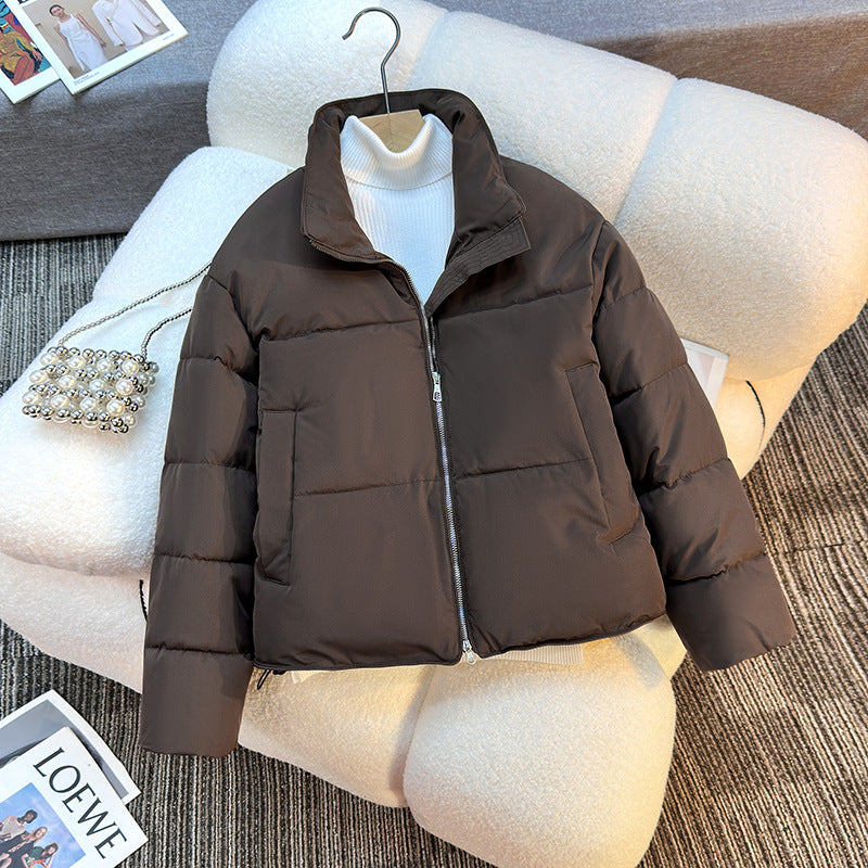 Short quilted jacket for women with high collar and practical piped pockets Lune London