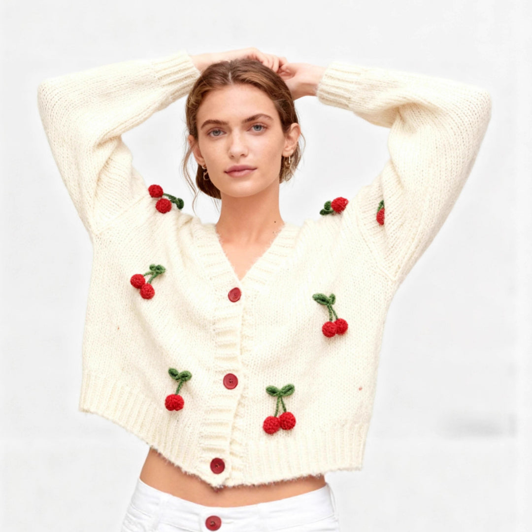 Knitted jacket for women with a cheerful cherry design and practical button details Lune London