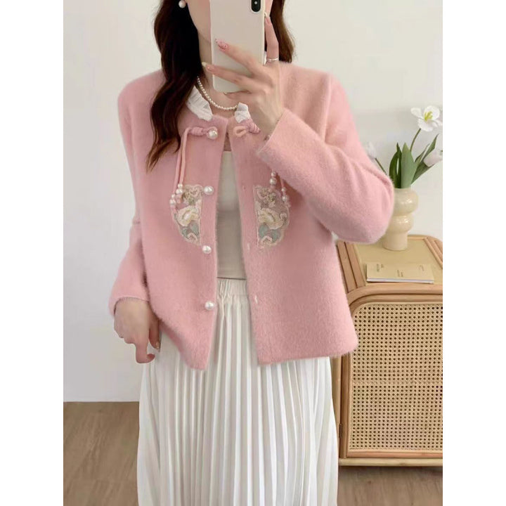 Luxurious knit sweater for women with decorative button details and ruffles Lune London