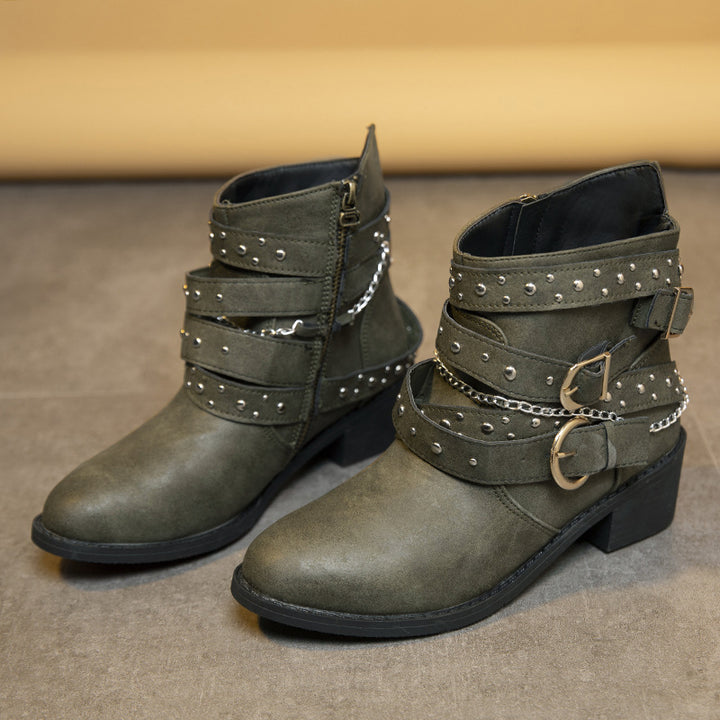 Trendy women's ankle boots with decorative straps and chain elements Lune London