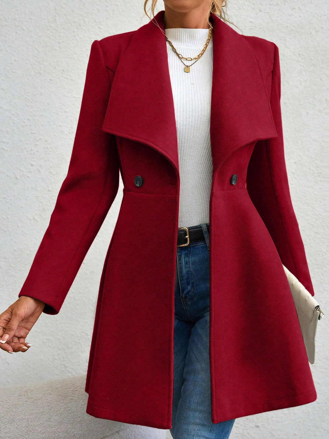 Ladies elegant wool coat with a loose and cinched silhouette and modern button details Lune London