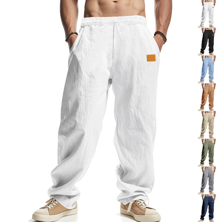 Linen pants for men with a relaxed fit featuring an adjustable drawstring and practical side pockets Lune London