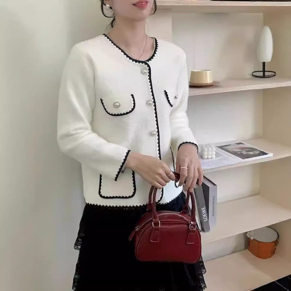 Ladies Elegant knitted vest with pockets adorned with beads and feminine accents Lune London