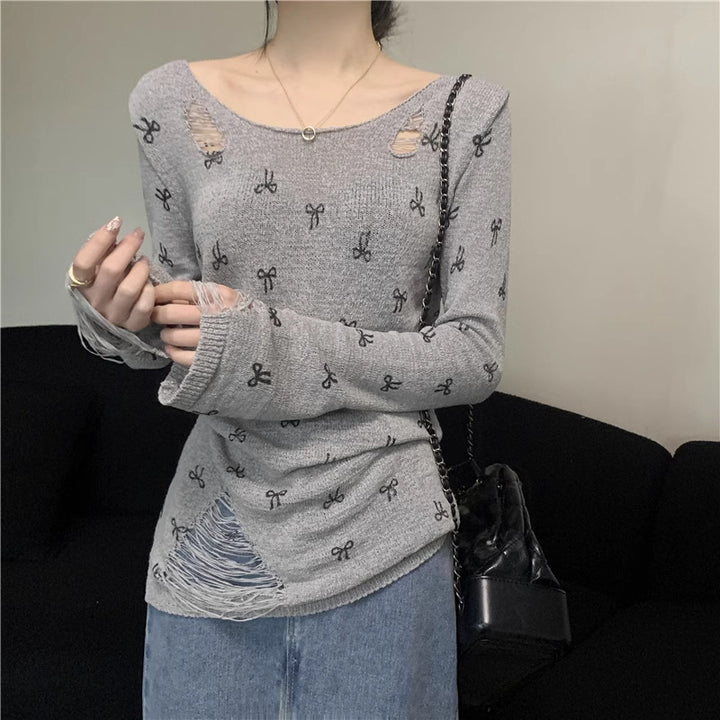 Women's long sleeve shirt with stylish rips and playful motif Lune London