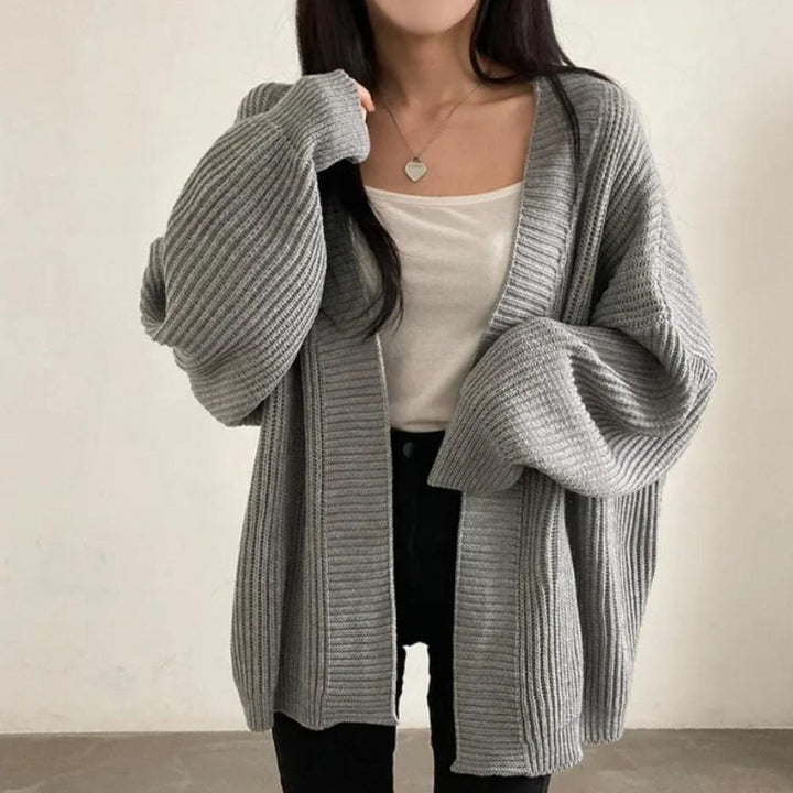 Plus size knitted jacket for women with wide sleeves and a structured texture Lune London