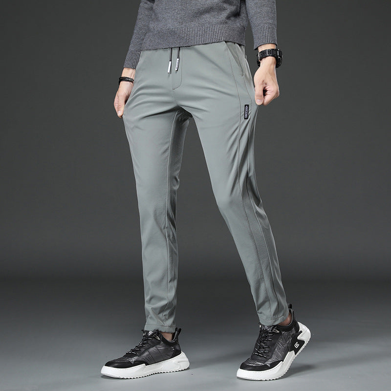 Men's slim fit sports pants with elastic waistband and practical zip pockets Lune London