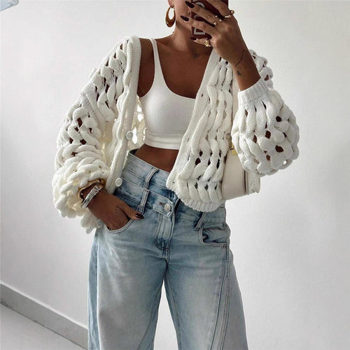 Women's knitted sweater with a unique hole pattern and a casual fit Lune London
