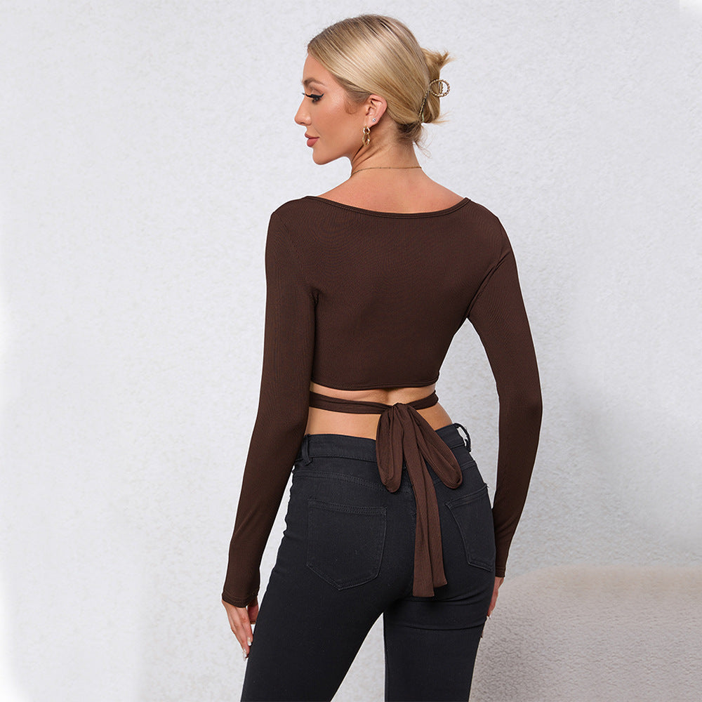 Women's cropped long sleeve shirt with decorative ring and wrap design Chic & Stil