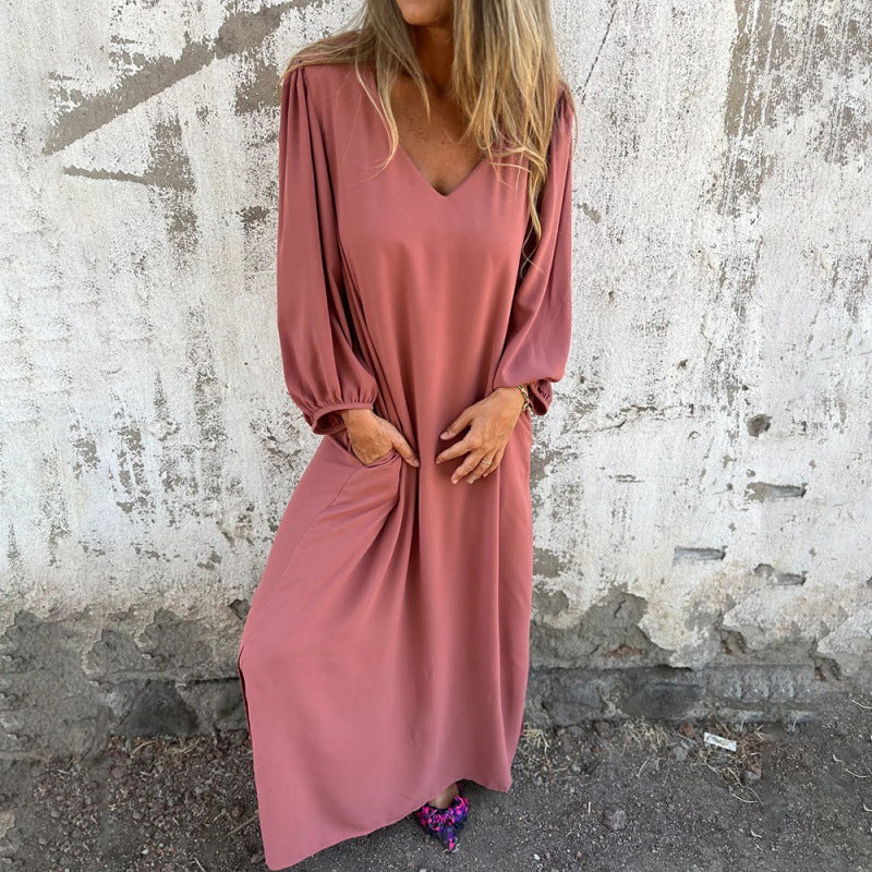 Maxi dress for women with deep V-neckline and practical side pockets Lune London