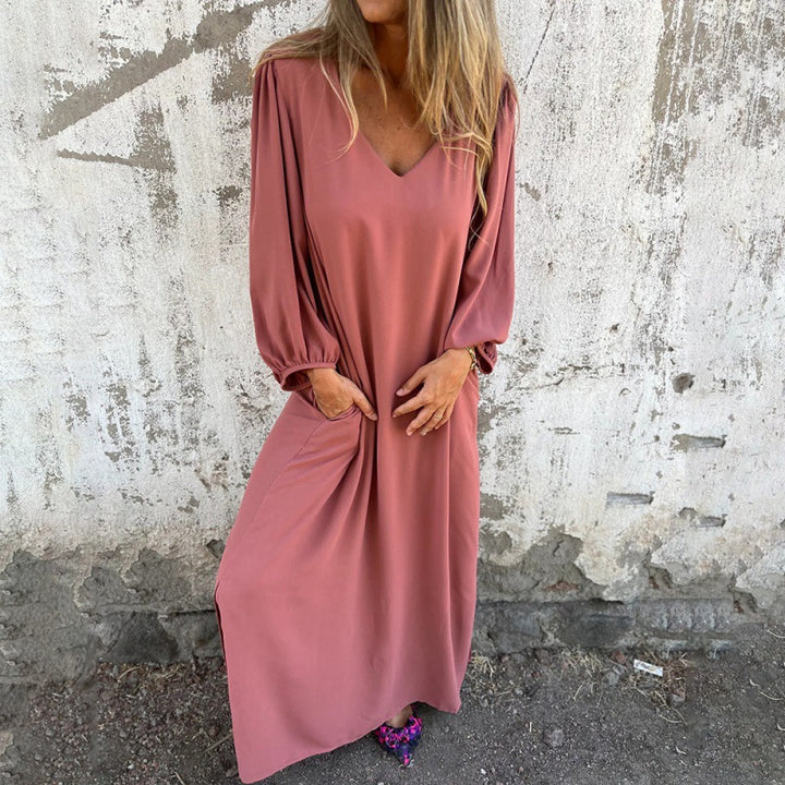 Maxi dress for women with deep V-neckline and practical side pockets Lune London