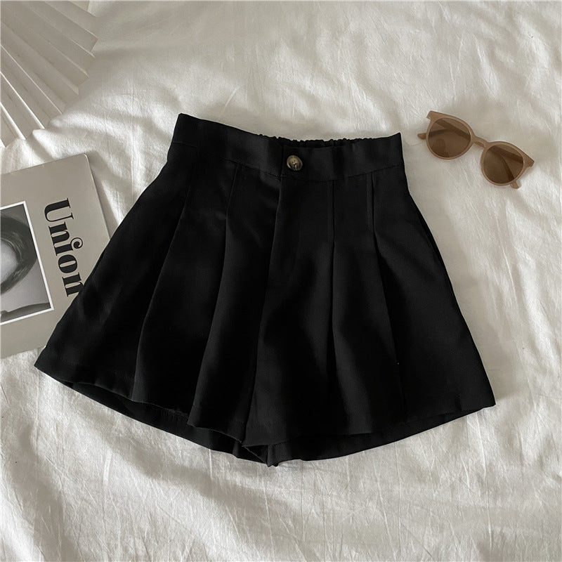 Women's elegant shorts with pleats and button detail