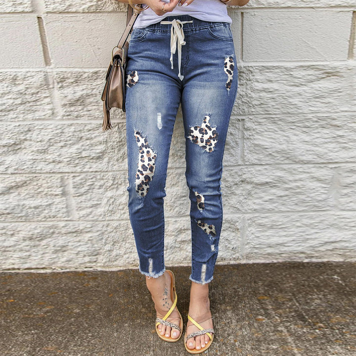 Trendy skinny jeans for women with a unique leopard design and ripped details Lune London
