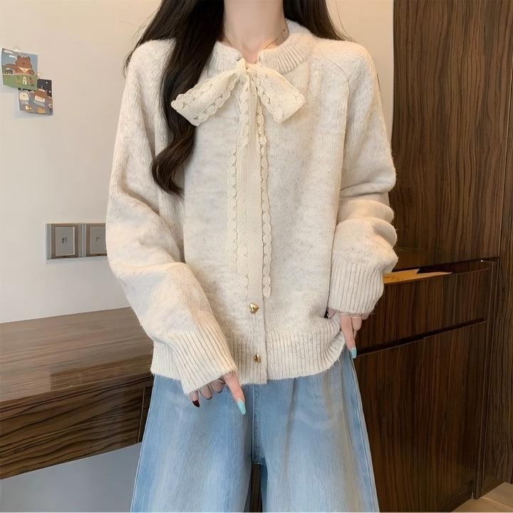 Women's knit jacket with playful lace ribbon and golden heart-shaped buttons Lune London