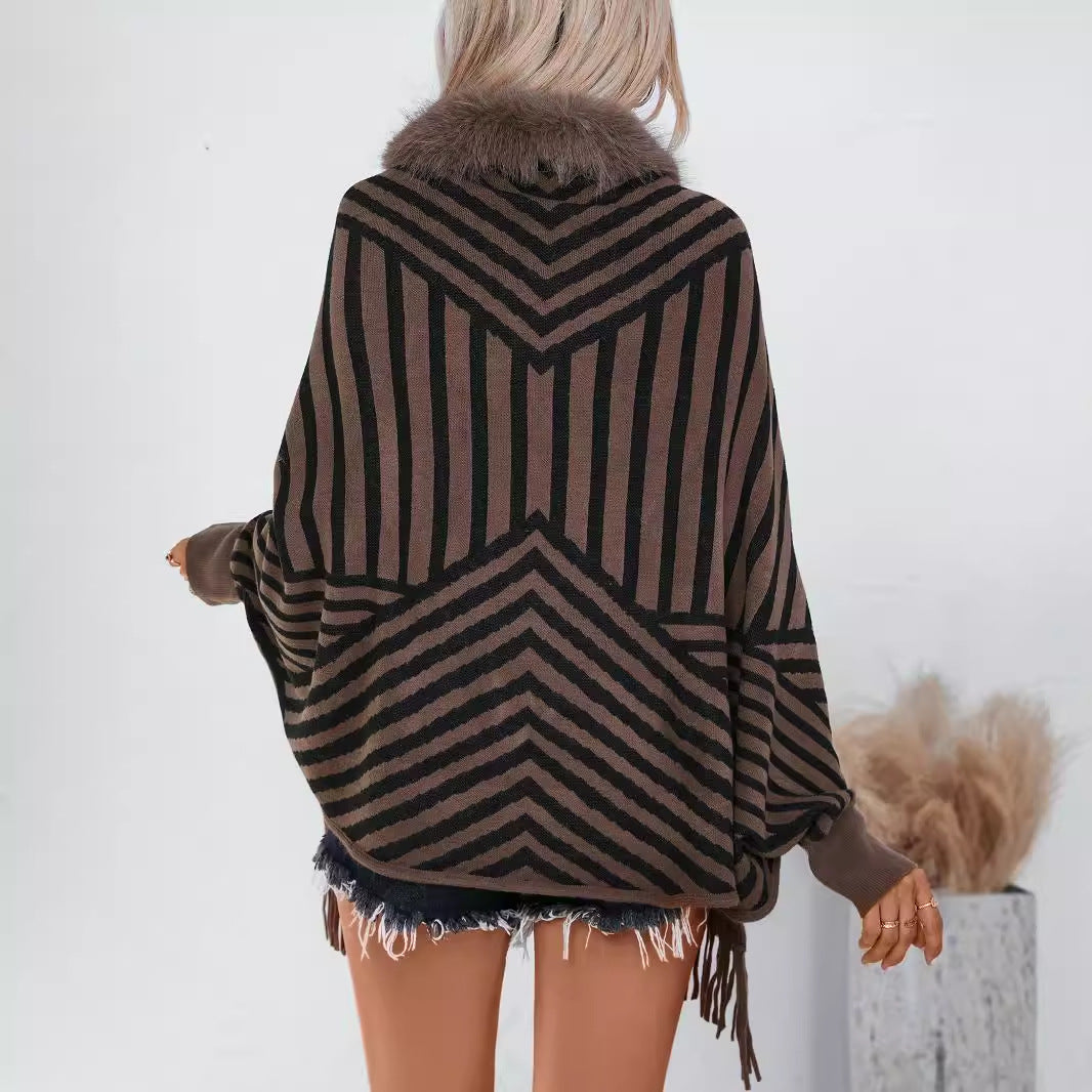 Ladies knitted poncho with elegant faux fur collar and fringe design Lune London