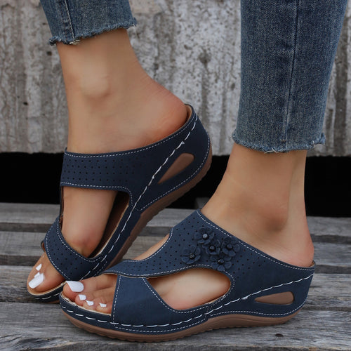Comfortable wedge sole sandals for women with an airy surface structure and elastic straps Lune London