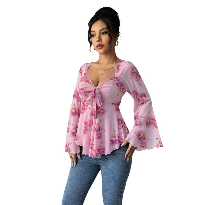 Blouse femme fluide avec design floral et nœud ludique Chic & Stil