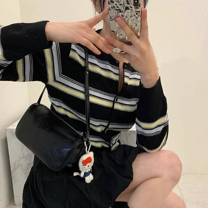 Sporty knitted jacket for women with a trendy striped pattern and playful buttons Lune London