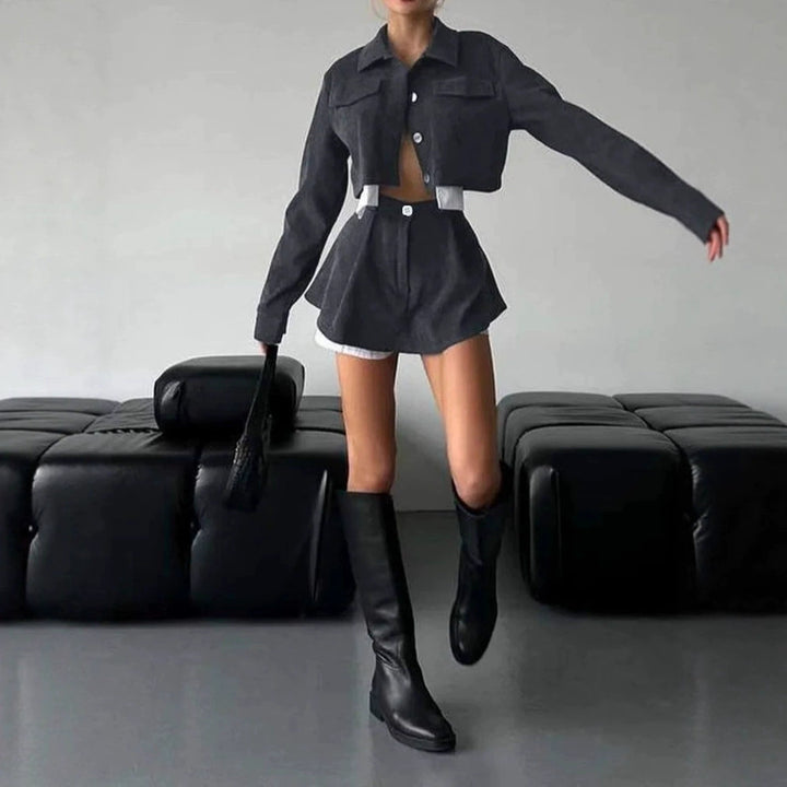 Women's stylish corduroy suit set with short jacket and flared skirt