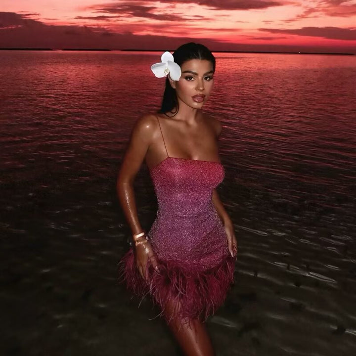 Glamorous ruffled dress for women with spaghetti straps and a feather-shaped hem Lune London