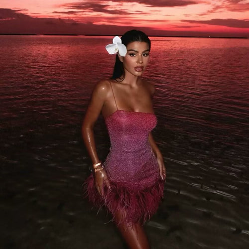 Glamorous ruffled dress for women with spaghetti straps and a feather-shaped hem Lune London