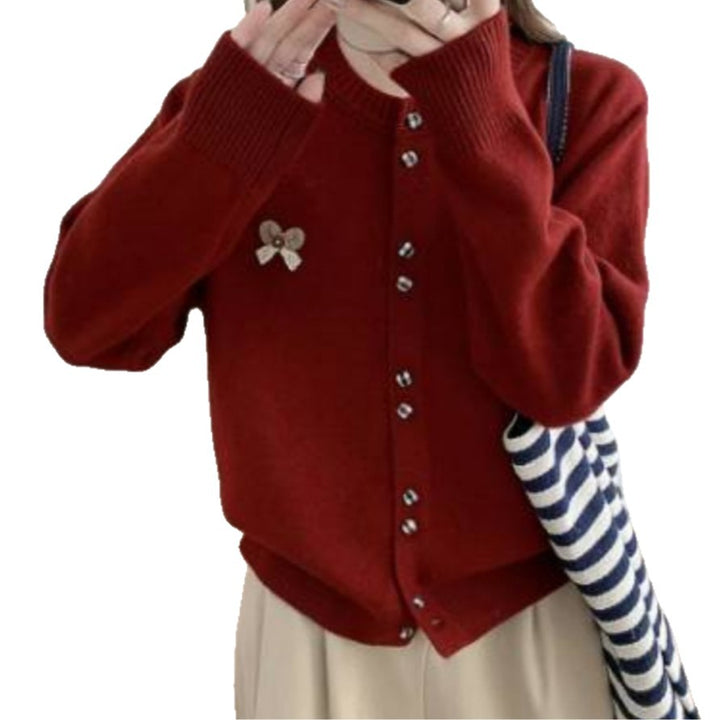 Ladies comfortable knitted cardigan with shiny buttons and decorative application Lune London