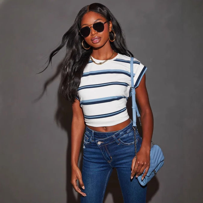 Women's flared jeans with trendy destroyed details and frayed hems