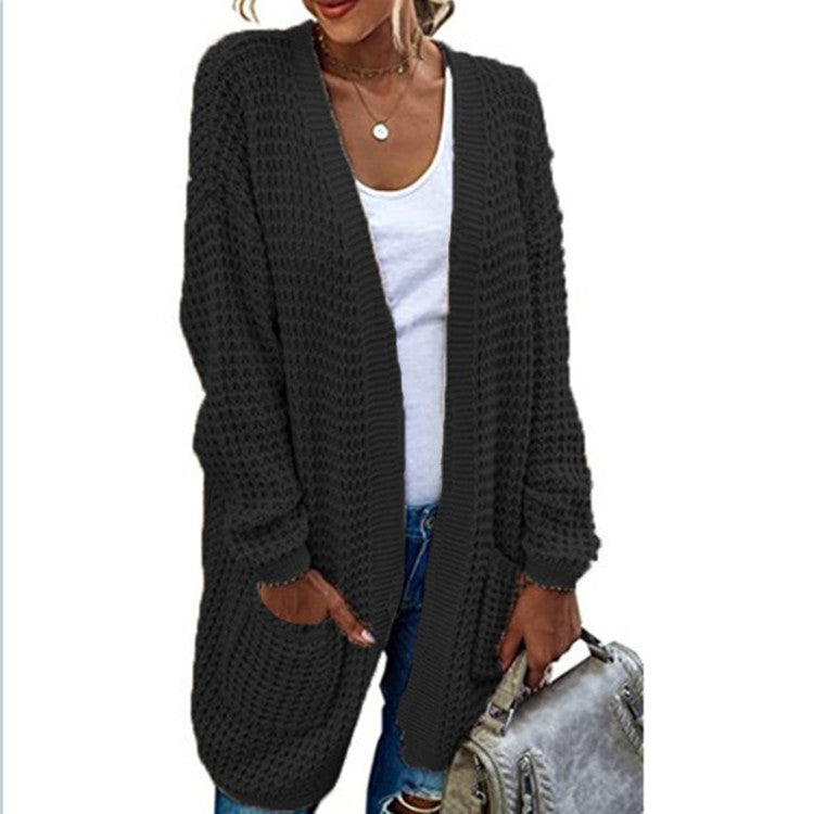 Chunky knit women’s cardigan with a relaxed fit and practical pockets Lune London