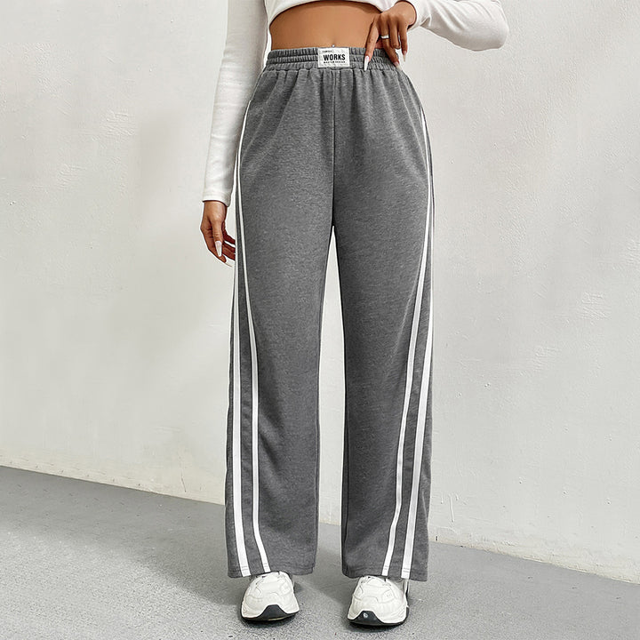 Pantalons de loisirs sportifs pour femmes avec coupe large et rayures contrastées Chic & Stil