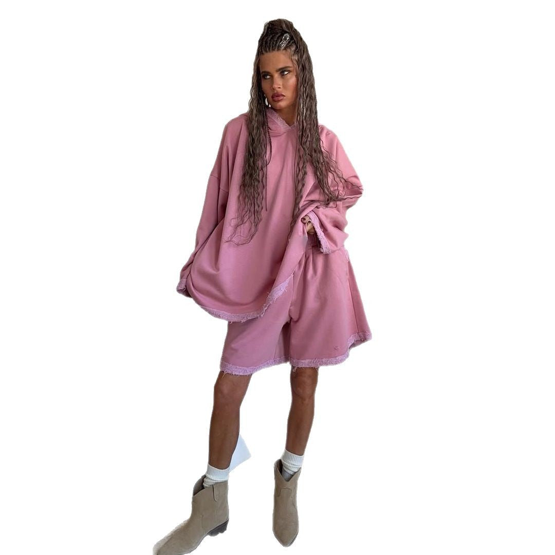 Ladies oversized sporty hoodie with frayed details and chic and stylish shorts set